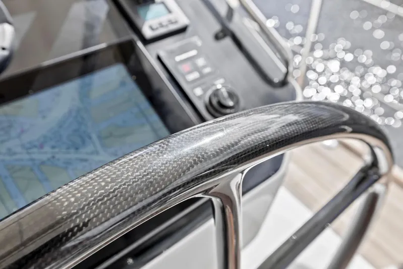 Blue Star Yacht Photos Pics Carbon fiber helm of 2013 Hylas 63 yacht with navigation display.