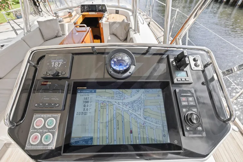 Blue Star Yacht Photos Pics Cockpit navigation system on a 2013 Hylas 63 yacht, featuring digital displays and controls.