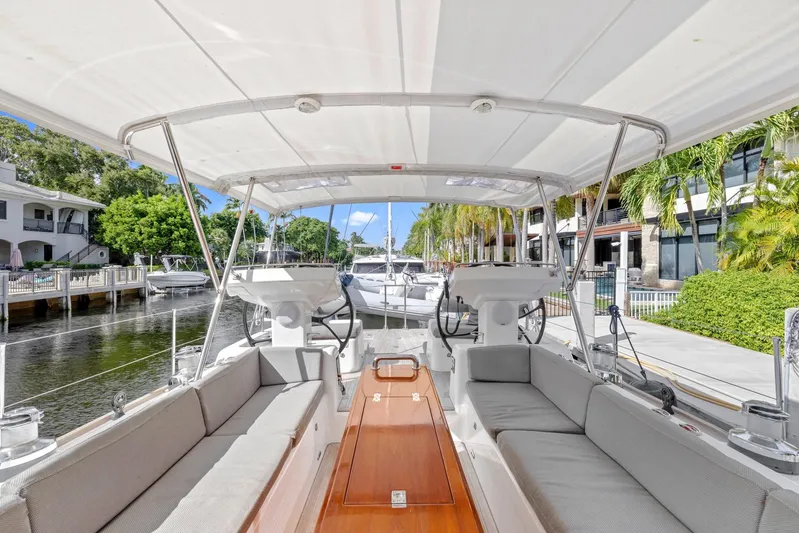 Blue Star Yacht Photos Pics Spacious deck of 2013 Hylas 63 yacht docked by a lush waterfront.