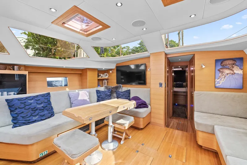 Blue Star Yacht Photos Pics Luxurious interior of a 2013 Hylas 63 yacht with modern seating and skylights.