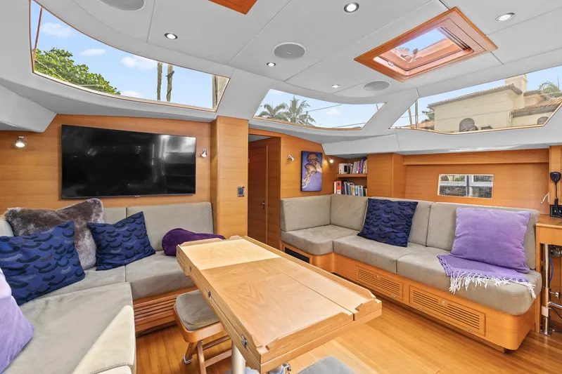 Blue Star Yacht Photos Pics Luxurious interior of 2013 Hylas 63 yacht with plush seating and modern decor.