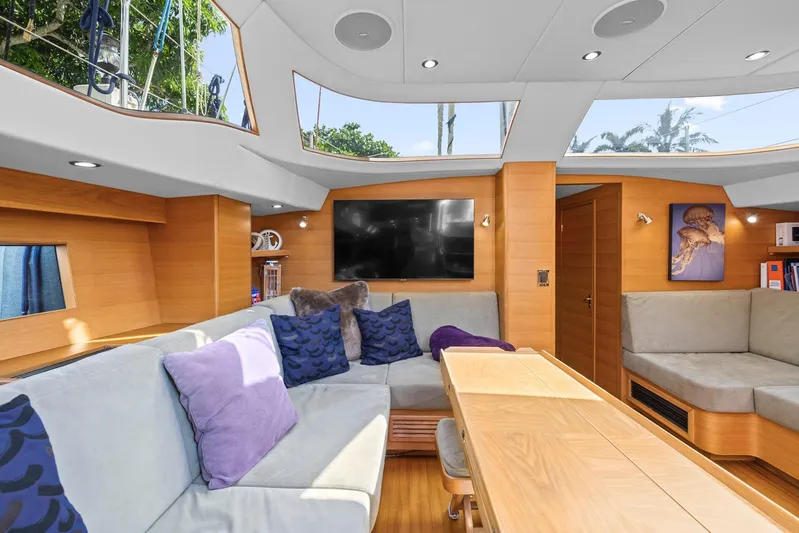 Blue Star Yacht Photos Pics Luxurious interior of a 2013 Hylas 63 yacht with modern furnishings and large windows.