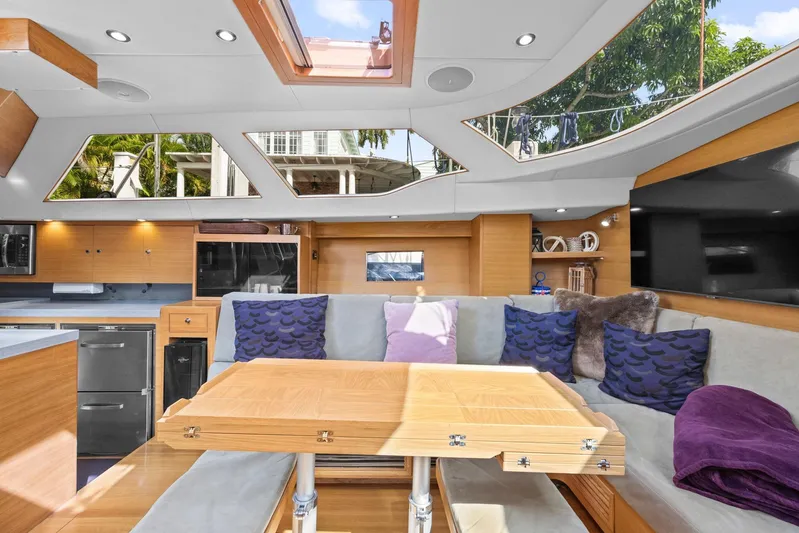 Blue Star Yacht Photos Pics Luxurious interior of 2013 Hylas 63 yacht with modern design and comfortable seating.