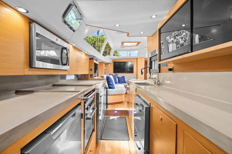 Blue Star Yacht Photos Pics Luxurious interior of 2013 Hylas 63 yacht with modern kitchen and seating area.