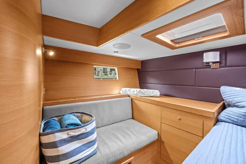 Blue Star Yacht Photos Pics Luxurious cabin interior of 2013 Hylas 63 yacht with modern wood finish.