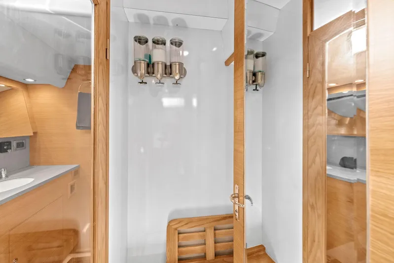 Blue Star Yacht Photos Pics Luxurious 2013 Hylas 63 yacht bathroom with wooden accents and modern fixtures.