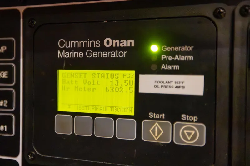 Blue Star Yacht Photos Pics Cummins Onan marine generator display on a 2013 Hylas 63 yacht, showing status and metrics.