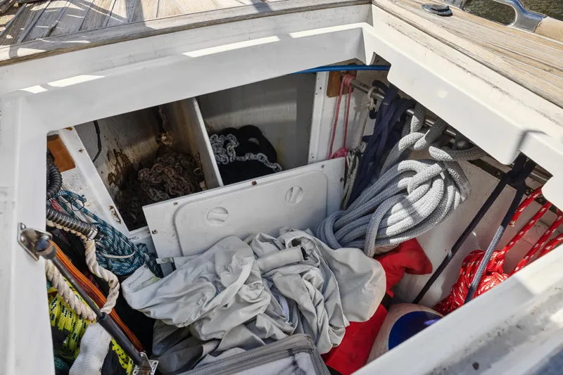 Blue Star Yacht Photos Pics Storage compartment on a 2013 Hylas 63 yacht with ropes and equipment.