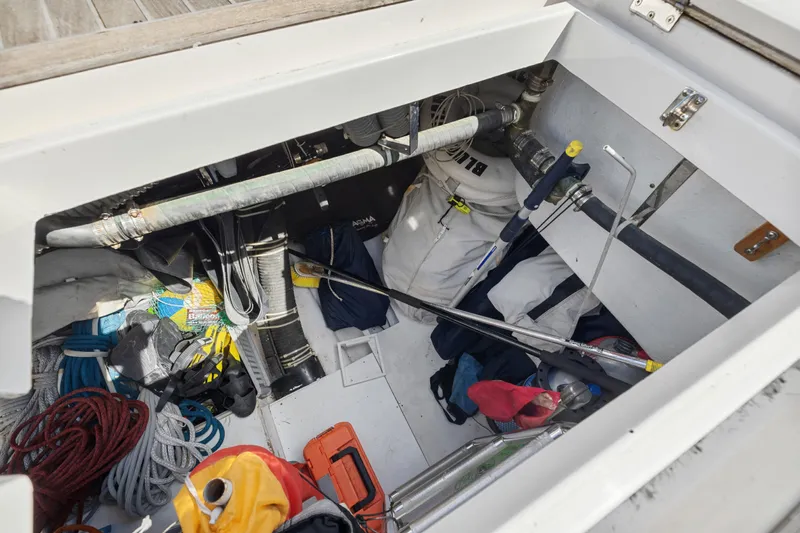 Blue Star Yacht Photos Pics Storage compartment of a 2013 Hylas 63 yacht with ropes and equipment.