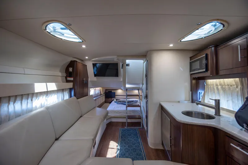  Yacht Photos Pics Interior of 2017 Regal 32 Express yacht with modern kitchen and cozy seating area.