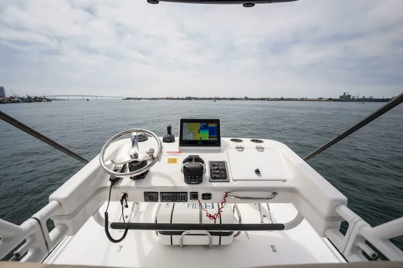Mad Hatter Yacht Photos Pics 2019 Everglades 435 Center Console helm with navigation system on open water.
