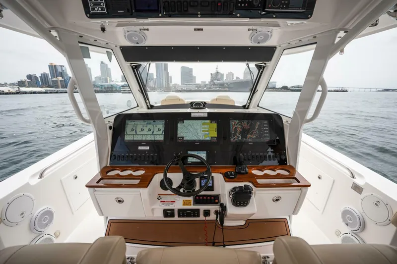 Mad Hatter Yacht Photos Pics 2019 Everglades 435 Center Console boat cockpit with advanced navigation systems.