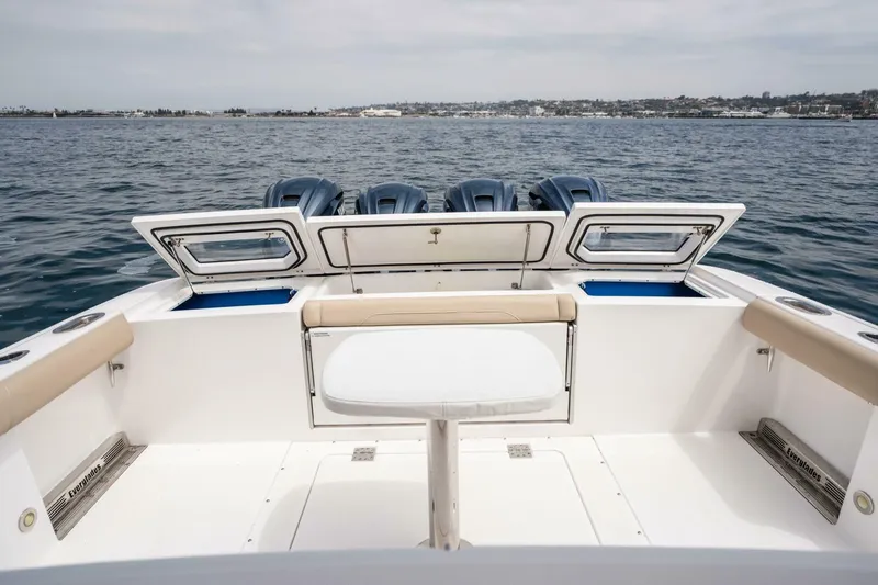 Mad Hatter Yacht Photos Pics 2019 Everglades 435 Center Console boat with open storage compartments on the ocean.