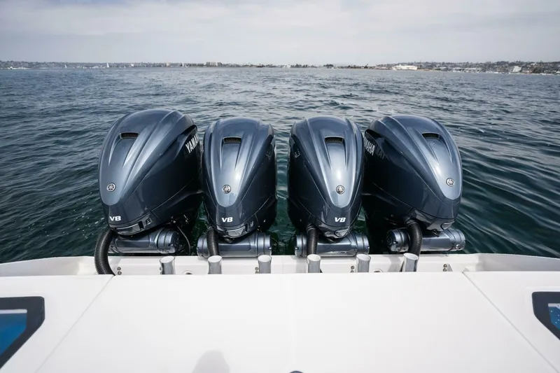 Mad Hatter Yacht Photos Pics 2019 Everglades 435 Center Console with four Yamaha V8 outboard engines on the water.