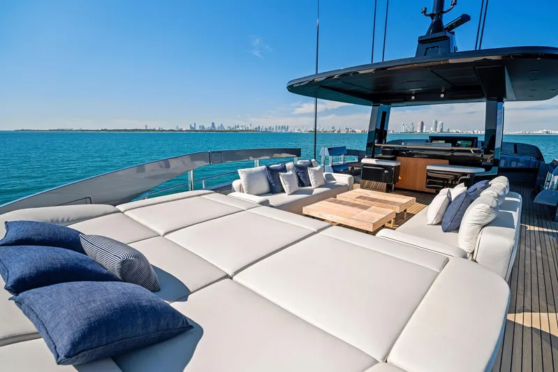 Caffeine Yacht Photos Pics 2023 Pershing GTX 116 yacht with luxurious deck, sun loungers, and ocean view.