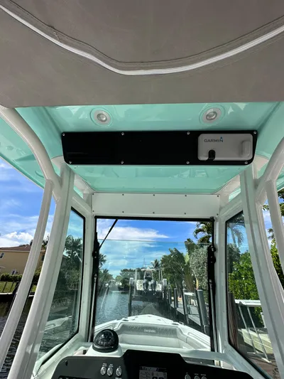  Yacht Photos Pics 2023 Everglades 235 boat interior view with navigation equipment.