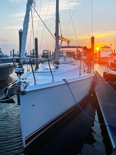 Wild Card Yacht Photos Pics Sailboat docked at sunset, 2005 Hunter 38 model, marina setting.