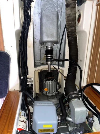 Wild Card Yacht Photos Pics Engine compartment of a 2005 Hunter 38 sailboat, showing mechanical components and wiring.