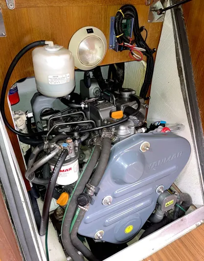 Wild Card Yacht Photos Pics Engine compartment of a 2005 Hunter 38 sailboat featuring a Yanmar engine.