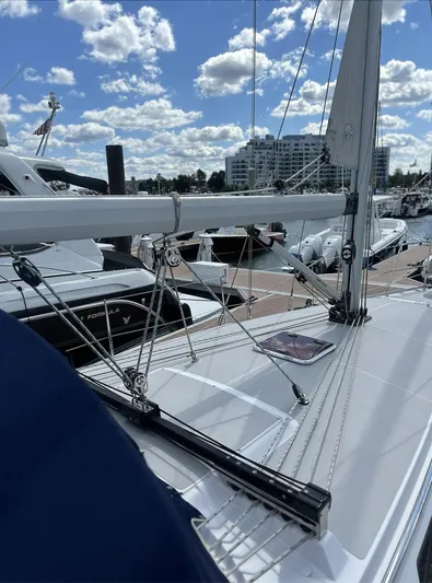 Sea Urchin Yacht Photos Pics 2013 Catalina 355 sailboat docked at marina under blue sky with clouds.
