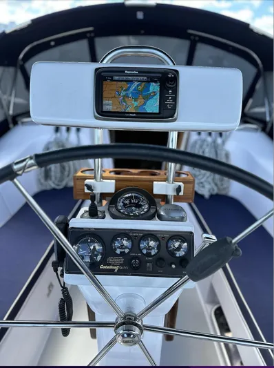 Sea Urchin Yacht Photos Pics Catalina 355 sailboat cockpit with navigation instruments, steering wheel, and GPS display, 2013 model.