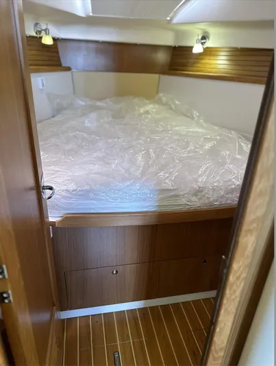 Sea Urchin Yacht Photos Pics 2013 Catalina 355 yacht cabin with wooden interior and cozy bed.