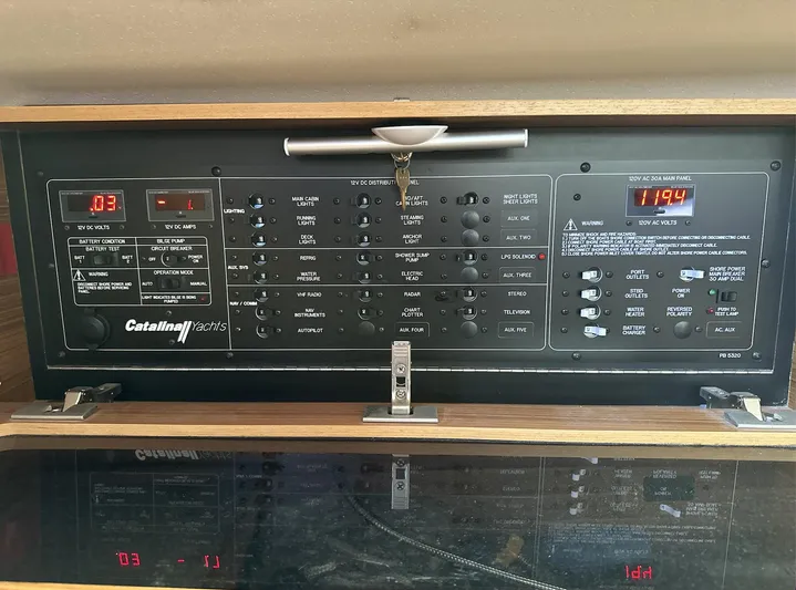 Sea Urchin Yacht Photos Pics Control panel of a 2013 Catalina 355 yacht with various switches and digital displays.