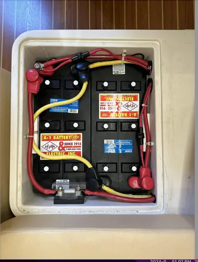 Sea Urchin Yacht Photos Pics Battery compartment of a 2013 Catalina 355 sailboat with wiring and labels visible.