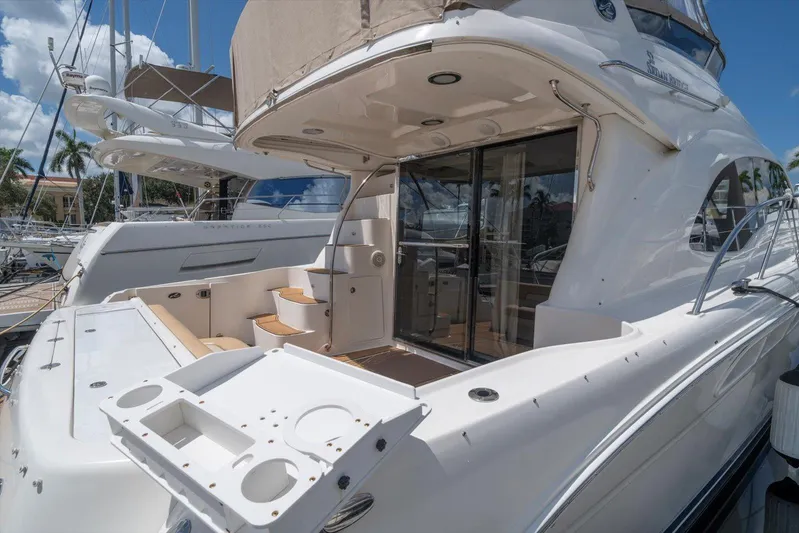 Vivid Imagination Yacht Photos Pics 2007 Sea Ray 52 Sedan Bridge yacht docked, showcasing spacious deck and elegant design.