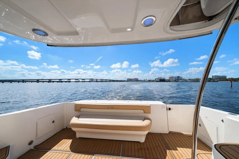 Vivid Imagination Yacht Photos Pics 2007 Sea Ray 52 Sedan Bridge yacht deck with scenic water view and clear blue sky.