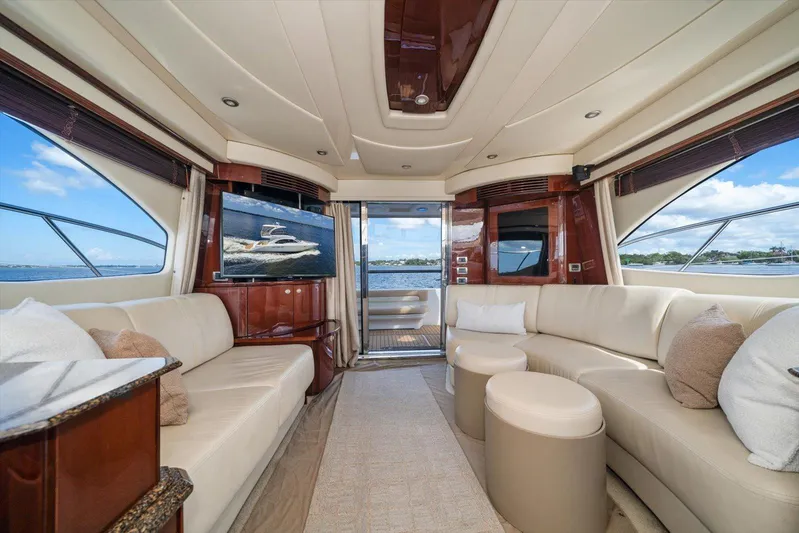 Vivid Imagination Yacht Photos Pics Luxurious interior of 2007 Sea Ray 52 Sedan Bridge yacht with plush seating and scenic views.