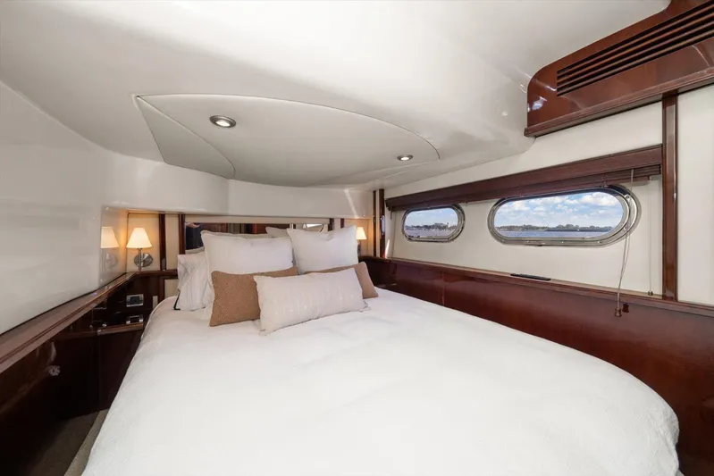 Vivid Imagination Yacht Photos Pics Luxurious bedroom interior of 2007 Sea Ray 52 Sedan Bridge yacht with elegant bedding.