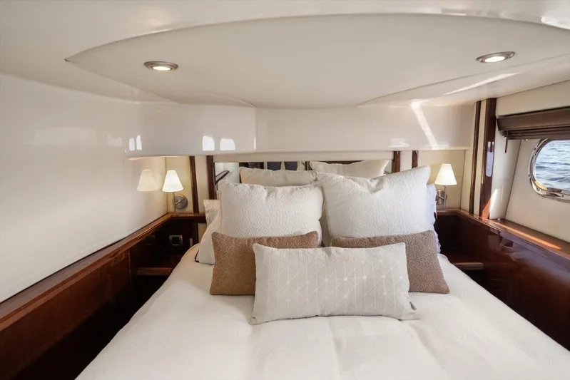 Vivid Imagination Yacht Photos Pics Luxurious bedroom interior of 2007 Sea Ray 52 Sedan Bridge yacht with elegant bedding.