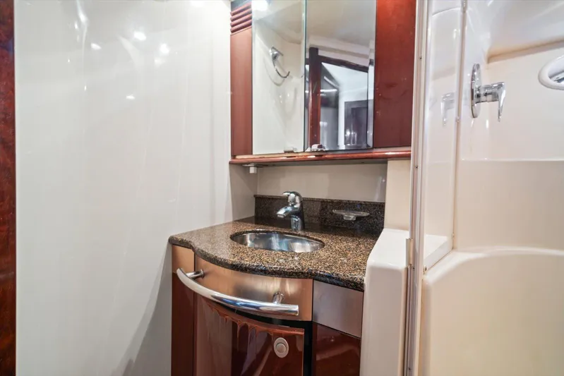 Vivid Imagination Yacht Photos Pics Luxurious bathroom in 2007 Sea Ray 52 Sedan Bridge yacht with granite countertop and modern fixtures.