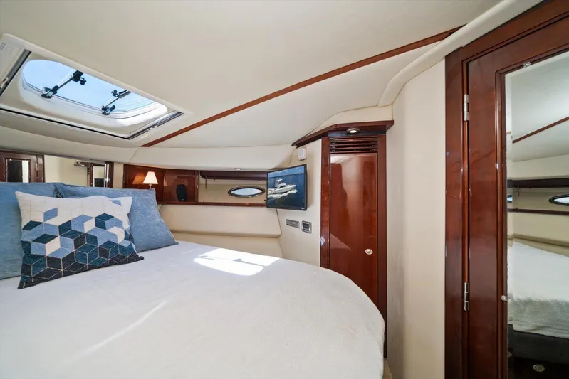 Vivid Imagination Yacht Photos Pics Luxurious 2007 Sea Ray 52 Sedan Bridge cabin interior with skylight and elegant wood finishes.
