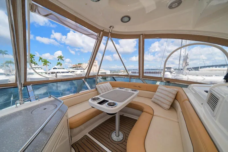 Vivid Imagination Yacht Photos Pics Luxurious 2007 Sea Ray 52 Sedan Bridge yacht interior with panoramic marina view.