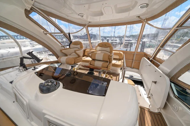 Vivid Imagination Yacht Photos Pics Luxurious 2007 Sea Ray 52 Sedan Bridge yacht interior with plush seating and panoramic views.