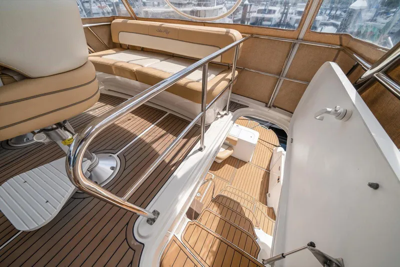 Vivid Imagination Yacht Photos Pics 2007 Sea Ray 52 Sedan Bridge interior with tan seating and polished railings.