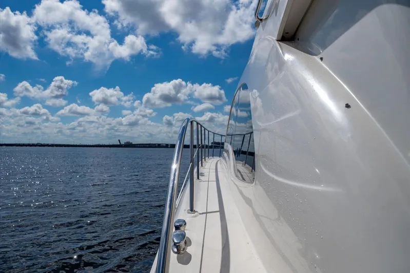 Vivid Imagination Yacht Photos Pics 2007 Sea Ray 52 Sedan Bridge yacht cruising on a sunny day with blue skies.