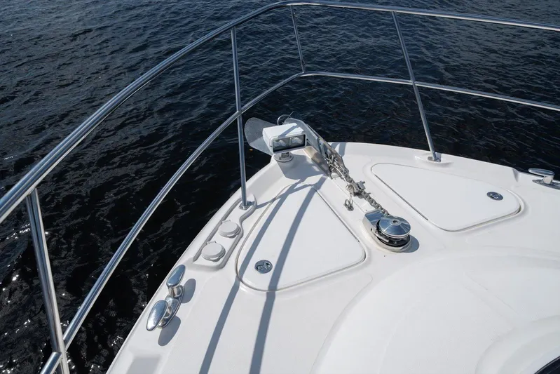 Vivid Imagination Yacht Photos Pics Bow of 2007 Sea Ray 52 Sedan Bridge yacht with anchor and railing.
