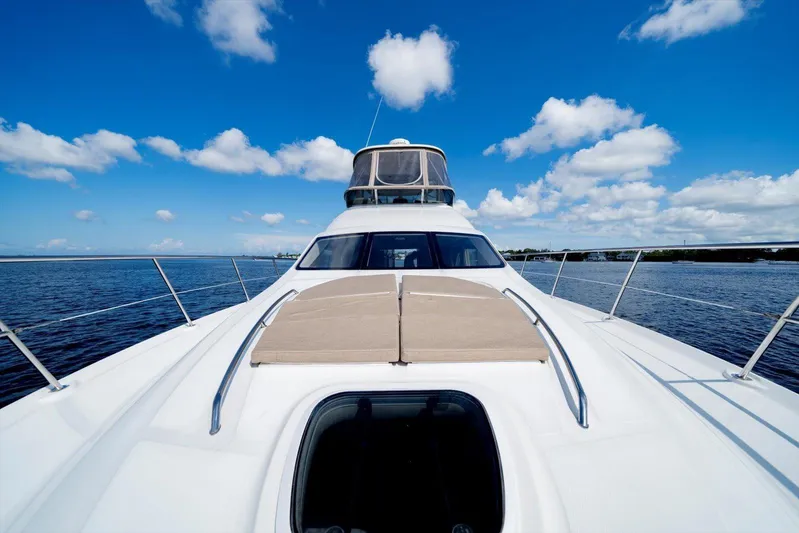 Vivid Imagination Yacht Photos Pics 2007 Sea Ray 52 Sedan Bridge yacht on open water under blue sky.