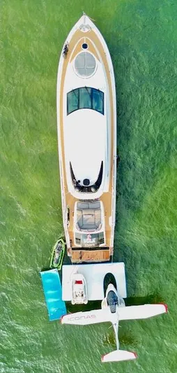 Volk Yacht Photos Pics Aerial view of 2009 Lazzara LSX 75 yacht with seaplane on green water.