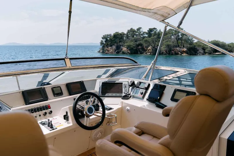 Markisia Yacht Photos Pics Luxurious 2010 Marquis 720 Flybridge yacht helm with scenic ocean view.