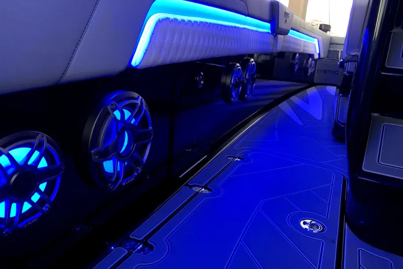  Yacht Photos Pics Interior of 2026 Mystic Powerboats M3800 with blue LED lighting and speakers.