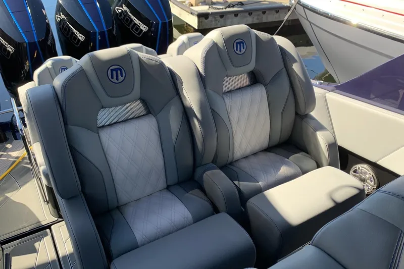  Yacht Photos Pics Luxurious seating on 2026 Mystic Powerboats M3800, featuring sleek design and premium materials.