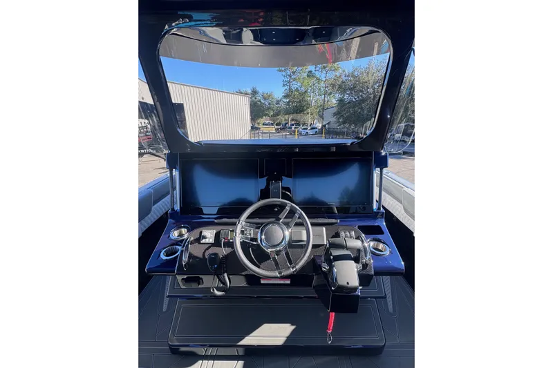  Yacht Photos Pics 2026 Mystic Powerboats M3800 helm with modern controls and dual screens.