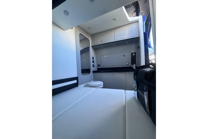  Yacht Photos Pics Interior of 2026 Mystic Powerboats M3800, featuring modern cabinetry and seating.