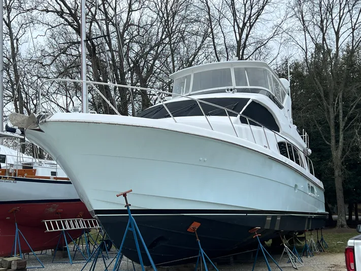 Lady J Yacht Photos Pics 2008 Hatteras 64 Motor Yacht on stands outdoors.