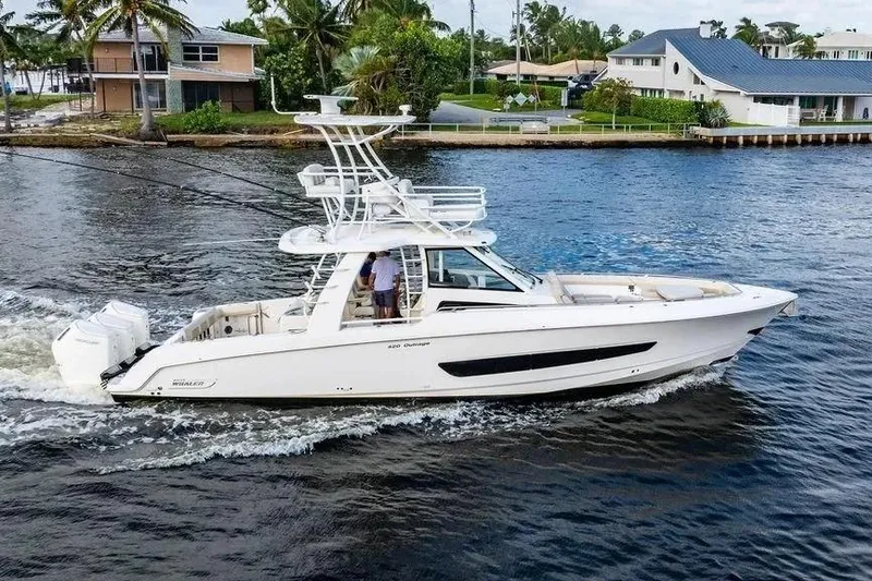  Yacht Photos Pics 2022 Boston Whaler 420 Outrage cruising on a scenic waterway.