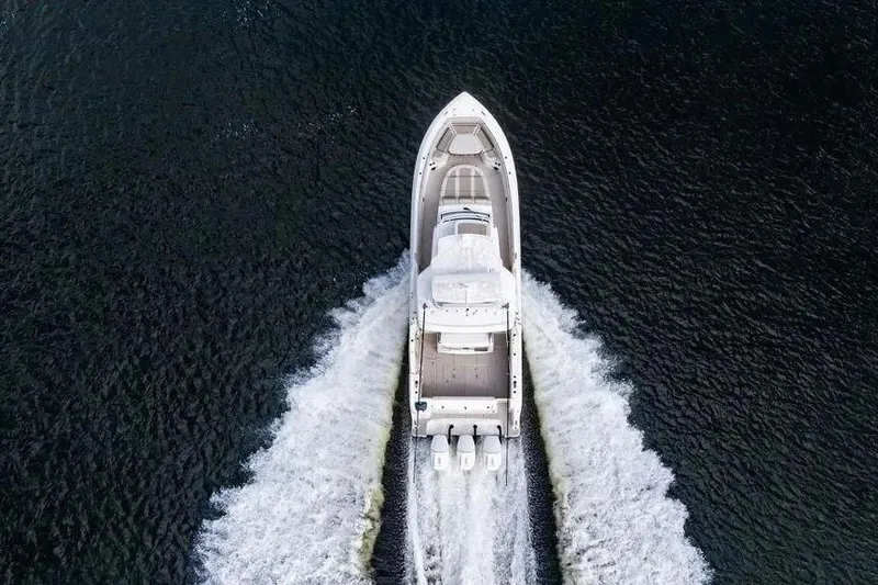  Yacht Photos Pics Aerial view of 2022 Boston Whaler 420 Outrage cruising on water.